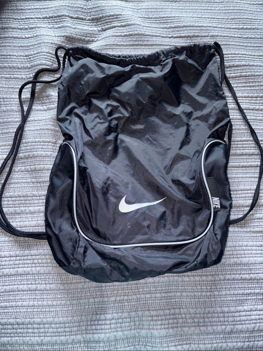 Nike Black Drawstring Backpack with White Swoosh